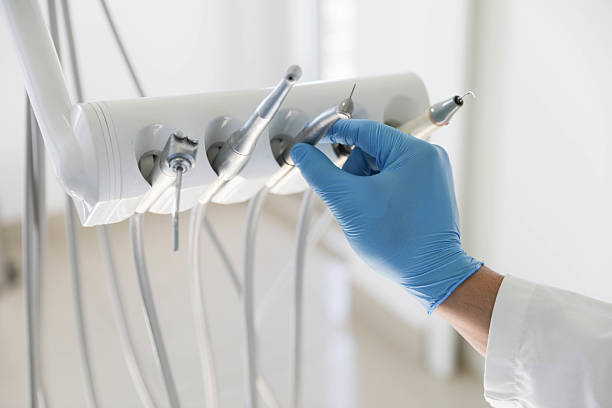 Professional Tooth Extraction technician working in Russiaville, IN
